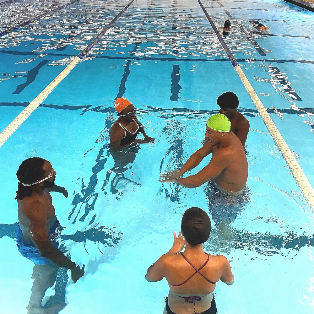 Small group swim lesson in progress